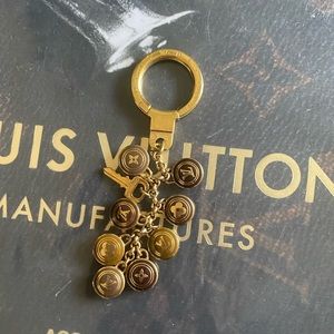 Louis Vuitton 2000s Gold and Burgundy Lock Charm Keychain · INTO